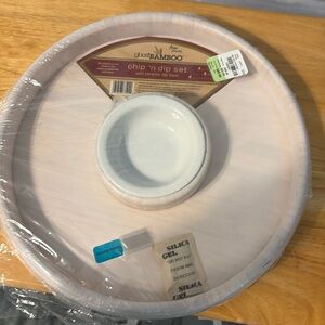 Brand new chip and dip set. Bamboo platter with a ceramic dip bowl.